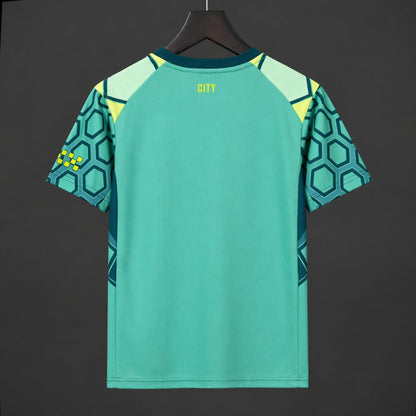 26/27 Manchester City Vibrant Green Goalkeeper Shirt With Dark Blue Geometric Pattern.