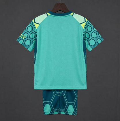 26/27 Kids Manchester City Vibrant Green Goalkeeper Shirt With Dark Blue Geometric Pattern.
