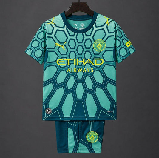 26/27 Kids Manchester City Vibrant Green Goalkeeper Shirt With Dark Blue Geometric Pattern.