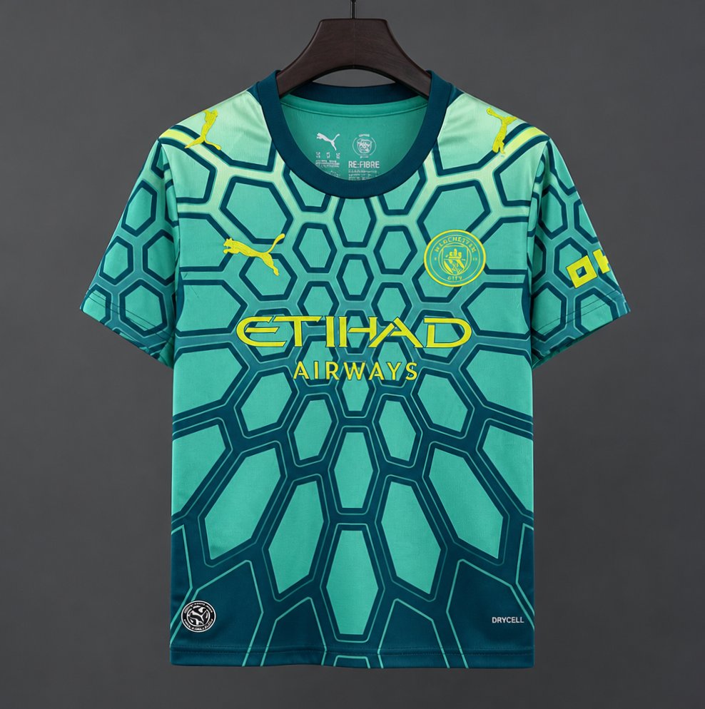26/27 Manchester City Vibrant Green Goalkeeper Shirt With Dark Blue Geometric Pattern.