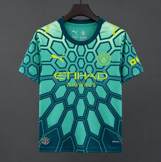 26/27 Manchester City Vibrant Green Goalkeeper Shirt With Dark Blue Geometric Pattern.
